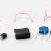 Through-hole, molded SMD and multilayer varistors shown beneath several surge waveform traces