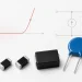 Through-hole, molded SMD and multilayer varistors beside a voltage-current curve and reference-current measurement circuit