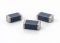 Three unmarked chip multilayer varistors on a white background