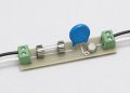 Line fuse, metal oxide varistor, and thermally coupled cutoff on a small circuit board