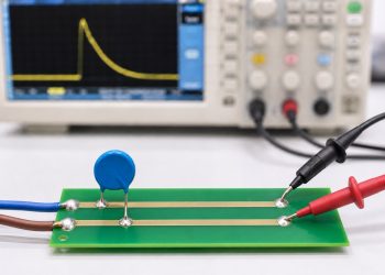 Oscilloscope probes measuring surge residual voltage between the protected node and local return after an MOV