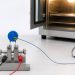 Metal oxide varistor with a thermocouple on a temperature test fixture